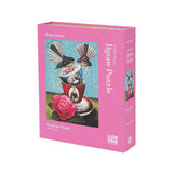Pink jigsaw puzzle box with bird and tea cup design on a white background