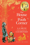 Book cover of 'The House at Pooh Corner' with a child, Pooh bear, and Tiger on an orange background.