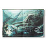 Open book with underwater scene illustration featuring a large creature and fish.