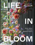 Book cover of 'Life in Bloom' with flowers and a window in the background