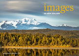 A scenic landscape print featuring snow-capped mountains, a golden-brown forest, and a reflective lake, with the text 'images OF NEW ZEALAND' in yellow and white at the top right.