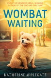 Book cover of 'Wombat Waiting' with a dog sitting on a bench in a sunlit street.